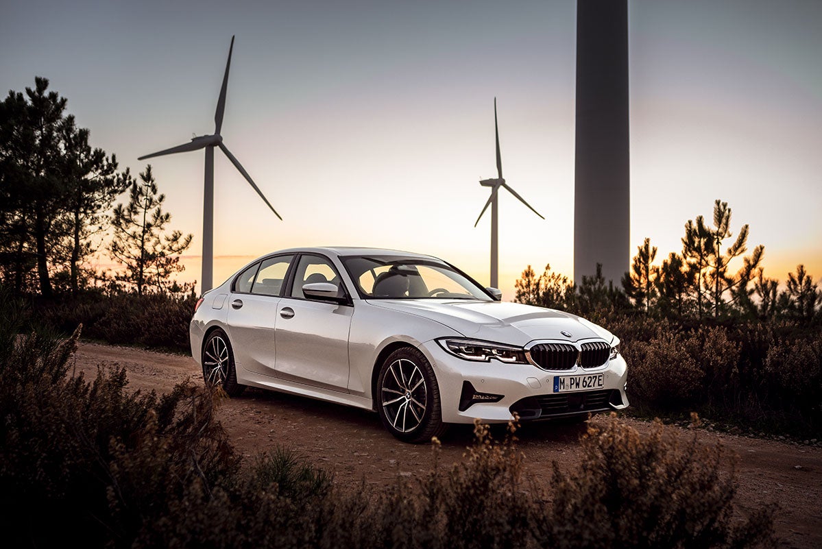 All-New 2022 BMW 330e with windmills in the background