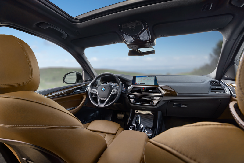 Image of a 2022 BMW X3's interior, as seen from the back seat