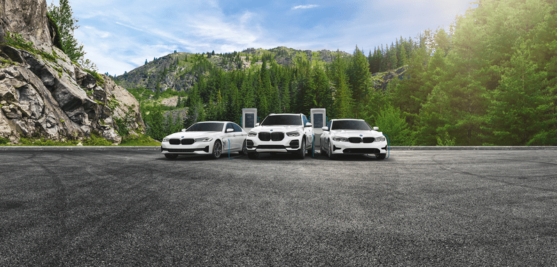 3 new white BMWs in a line