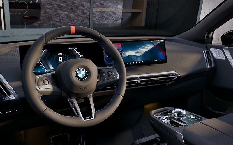 Interior steering wheel and dashboard of the BMW iX M70. | BMW of Dayton in Dayton OH