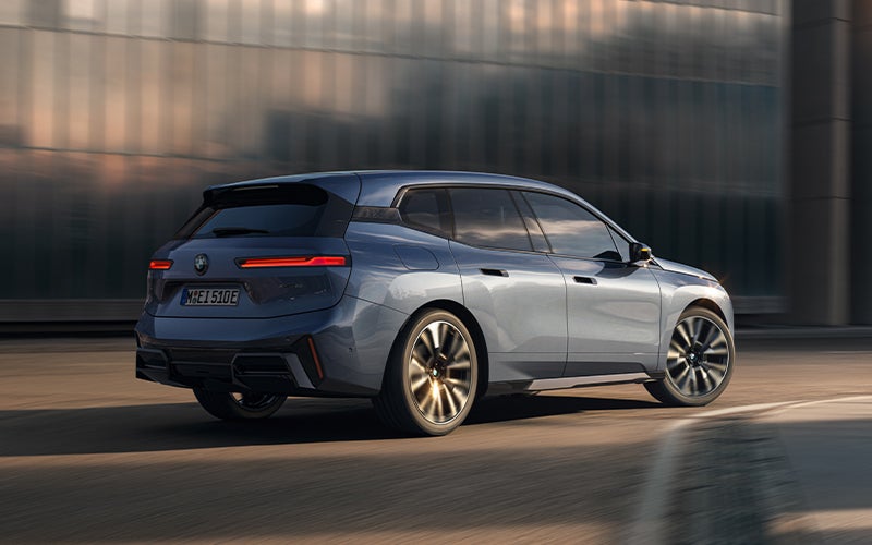 The BMW iX driving with the front wheel turned. | BMW of Dayton in Dayton OH