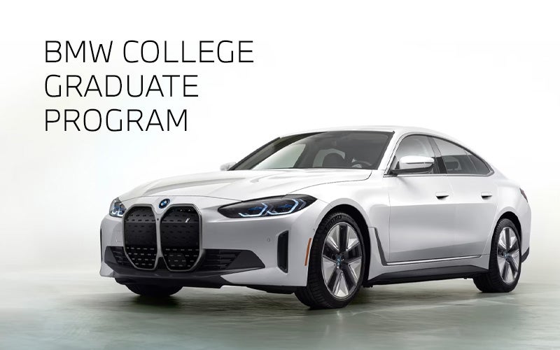 White BMW i4 parked. BMW College Graduate Program. | BMW of Dayton in Dayton OH