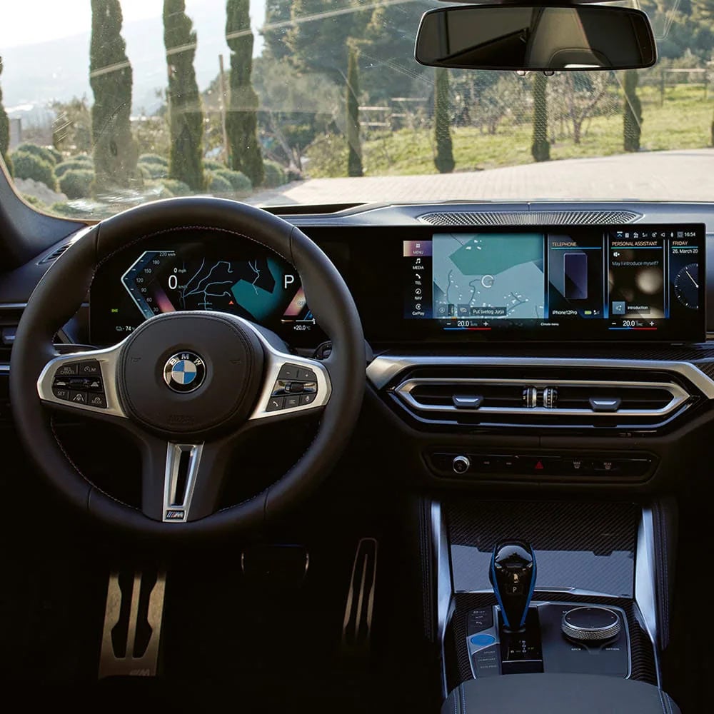 A driver's eye view of steering wheel and controls of the BMW i4 | BMW of Dayton in Dayton OH